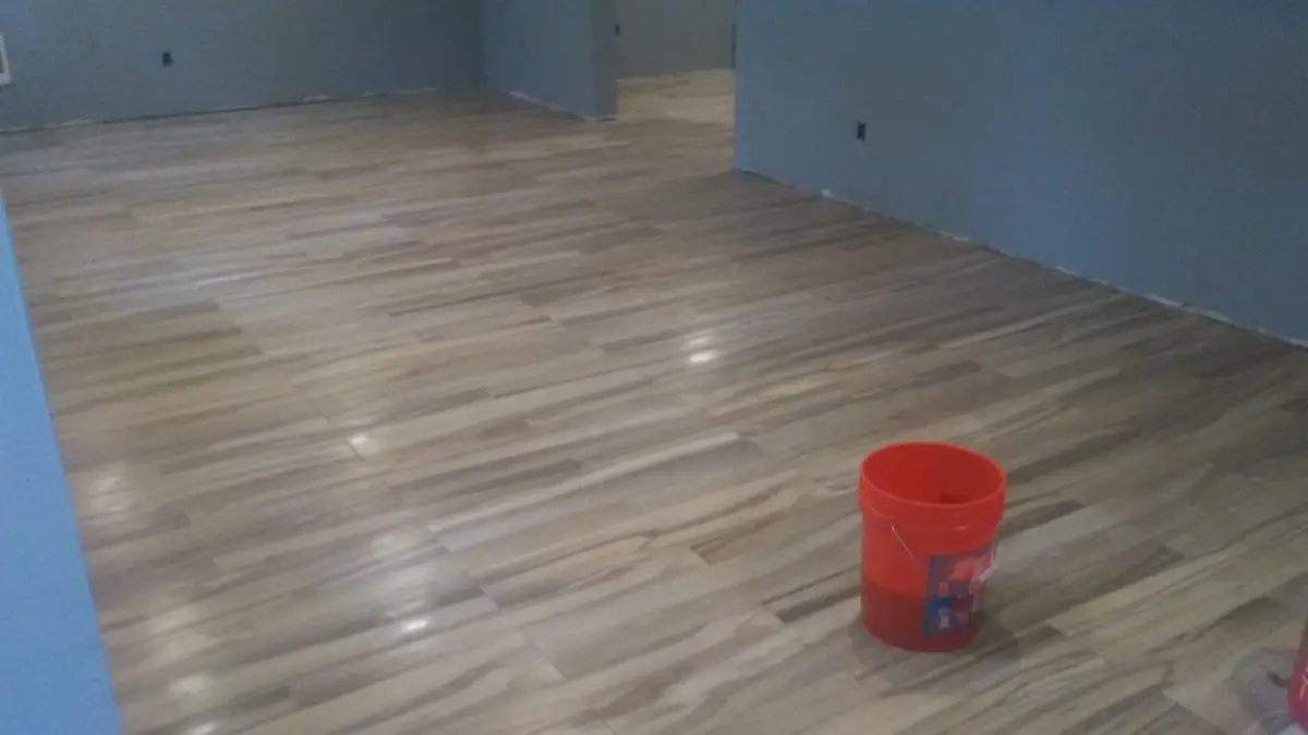 Wood-look tile flooring in a finished basement