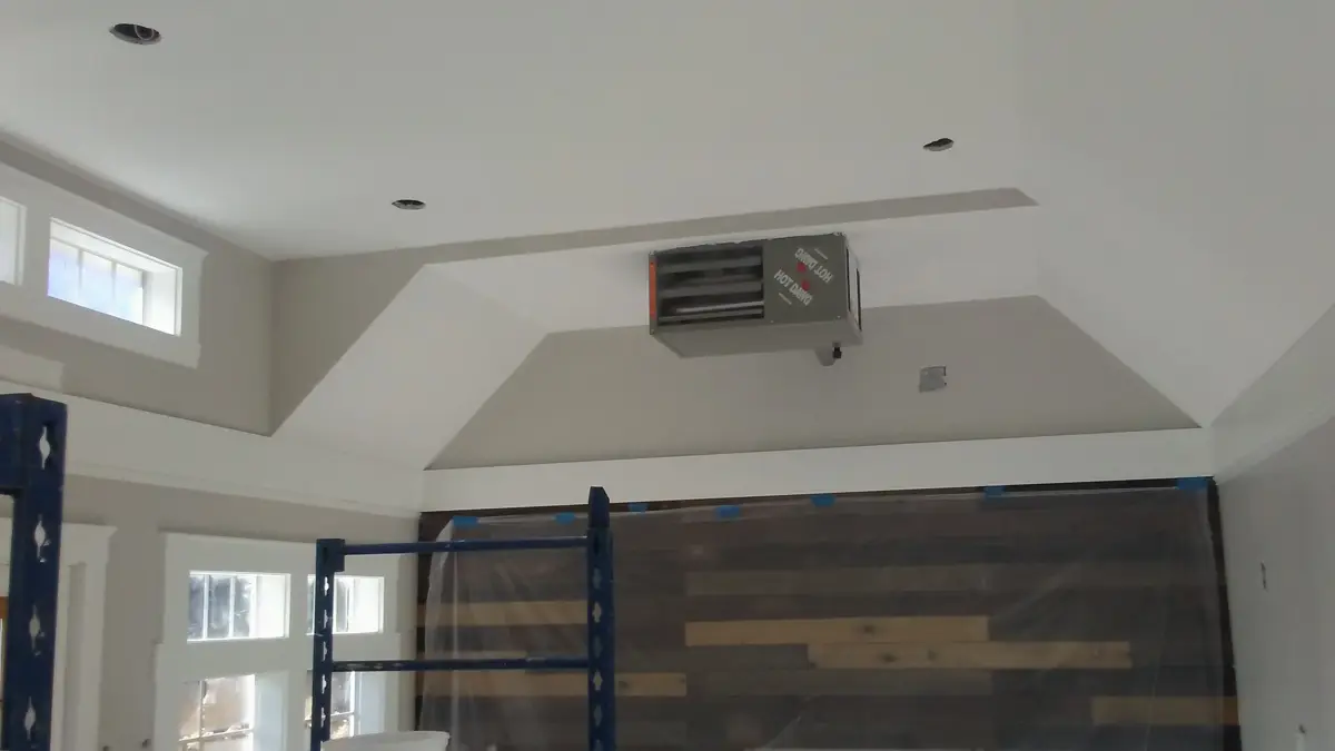 Room with vaulted ceiling and reclaimed wood accent wall