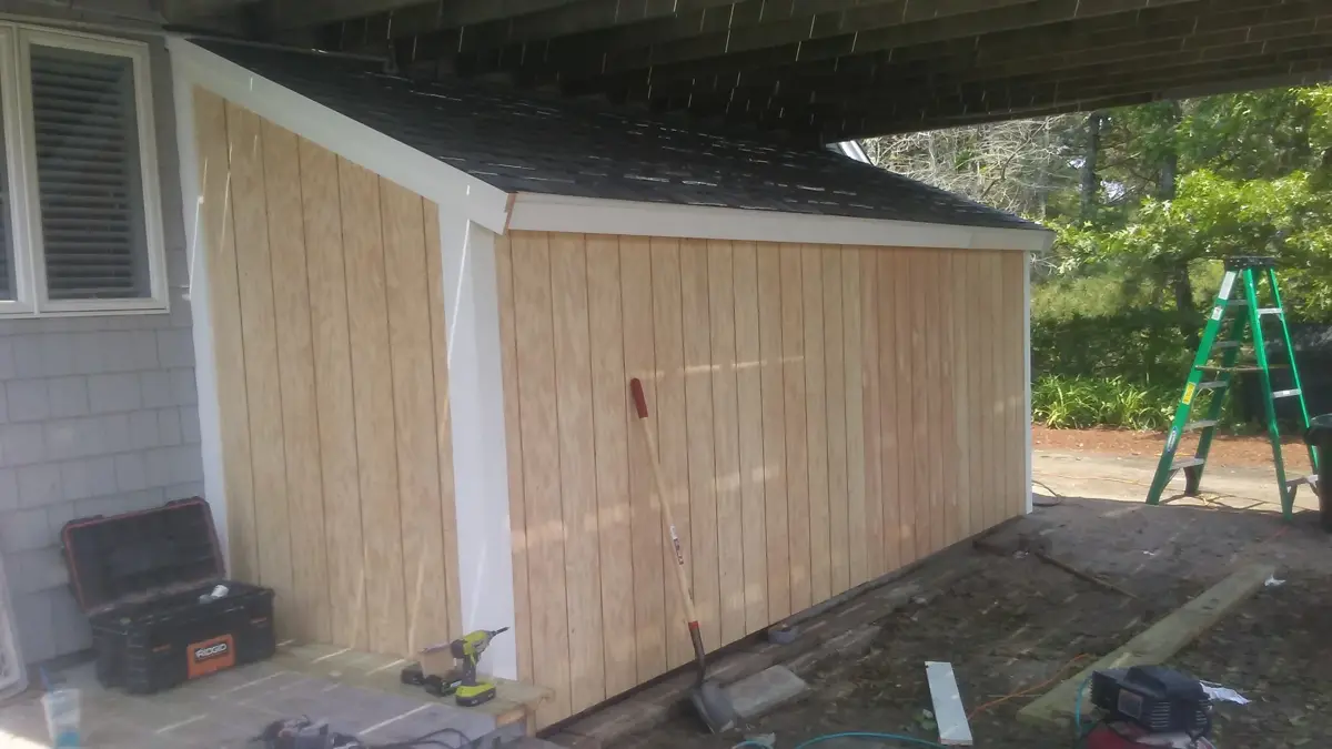 Finished shed with new wood siding