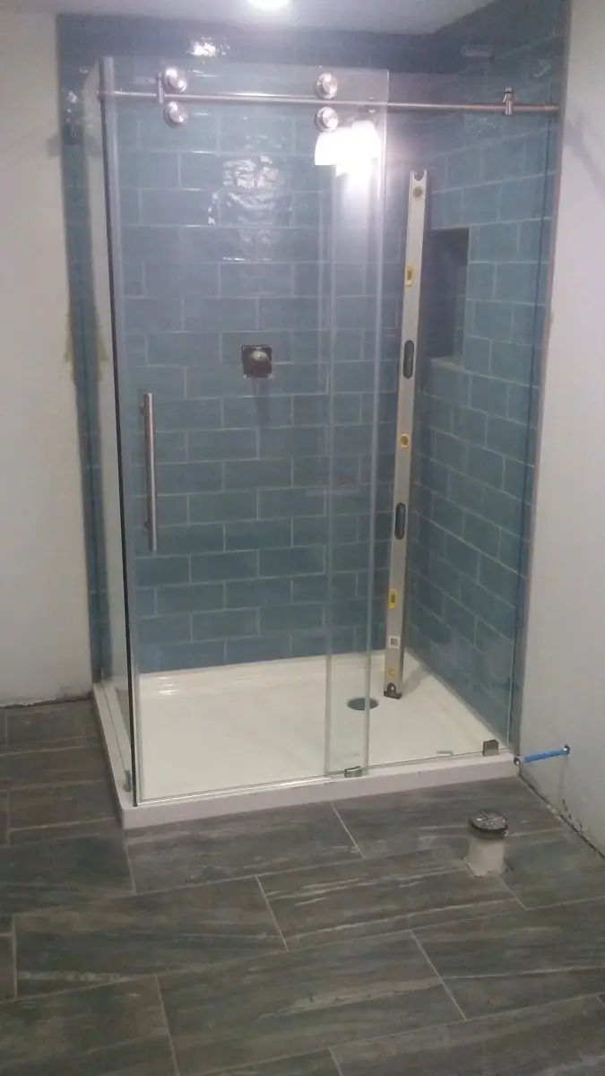 Glass-enclosed tile shower