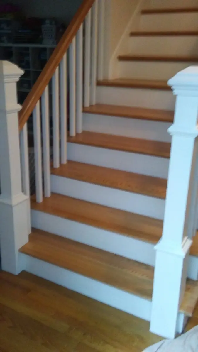 New staircase with white risers and wood treads